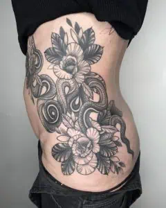Snake and Flowers Blackwork Tattoo