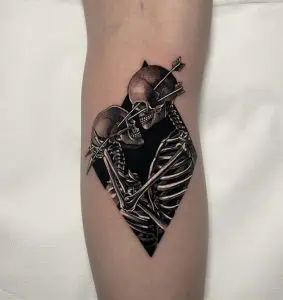 Skeletons and arrows tattoo