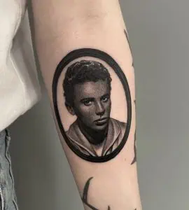 A medallion portrait tattoo