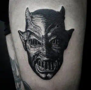 Devils face engraving medieval tattoo