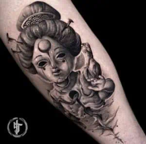Japanese Tattoo of A Figurine