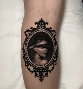 Abstract fineline medallion tattoo