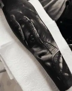 Horror Themed Black and Grey Realism Tattoo