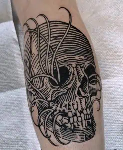 Skull tattoo design with linework and abstract elements