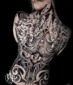 Black and grey tattoo backpiece detailed female portraiture and abstract elements